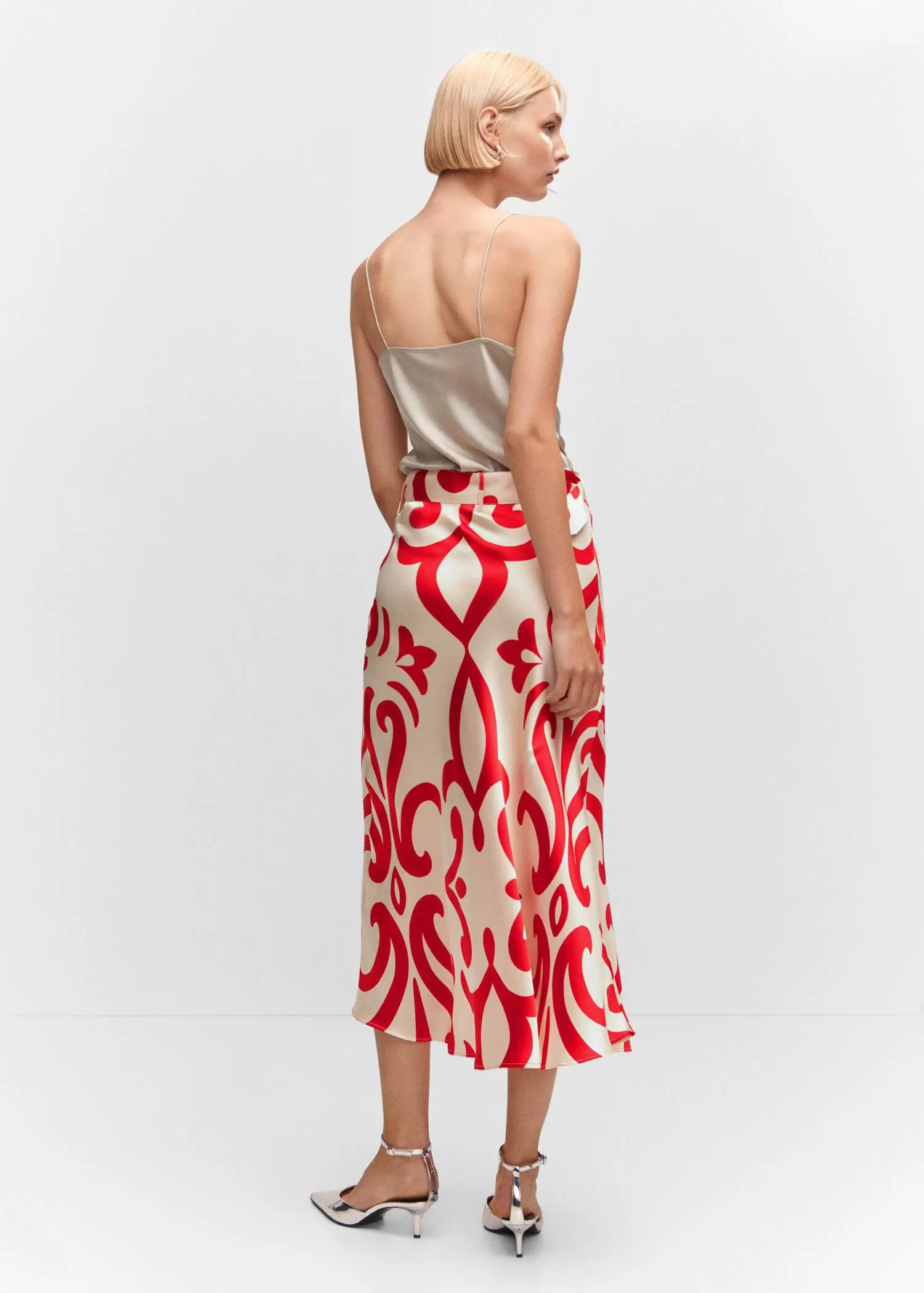 Mango Belt printed skirt. a woman wearing a red and white skirt. 