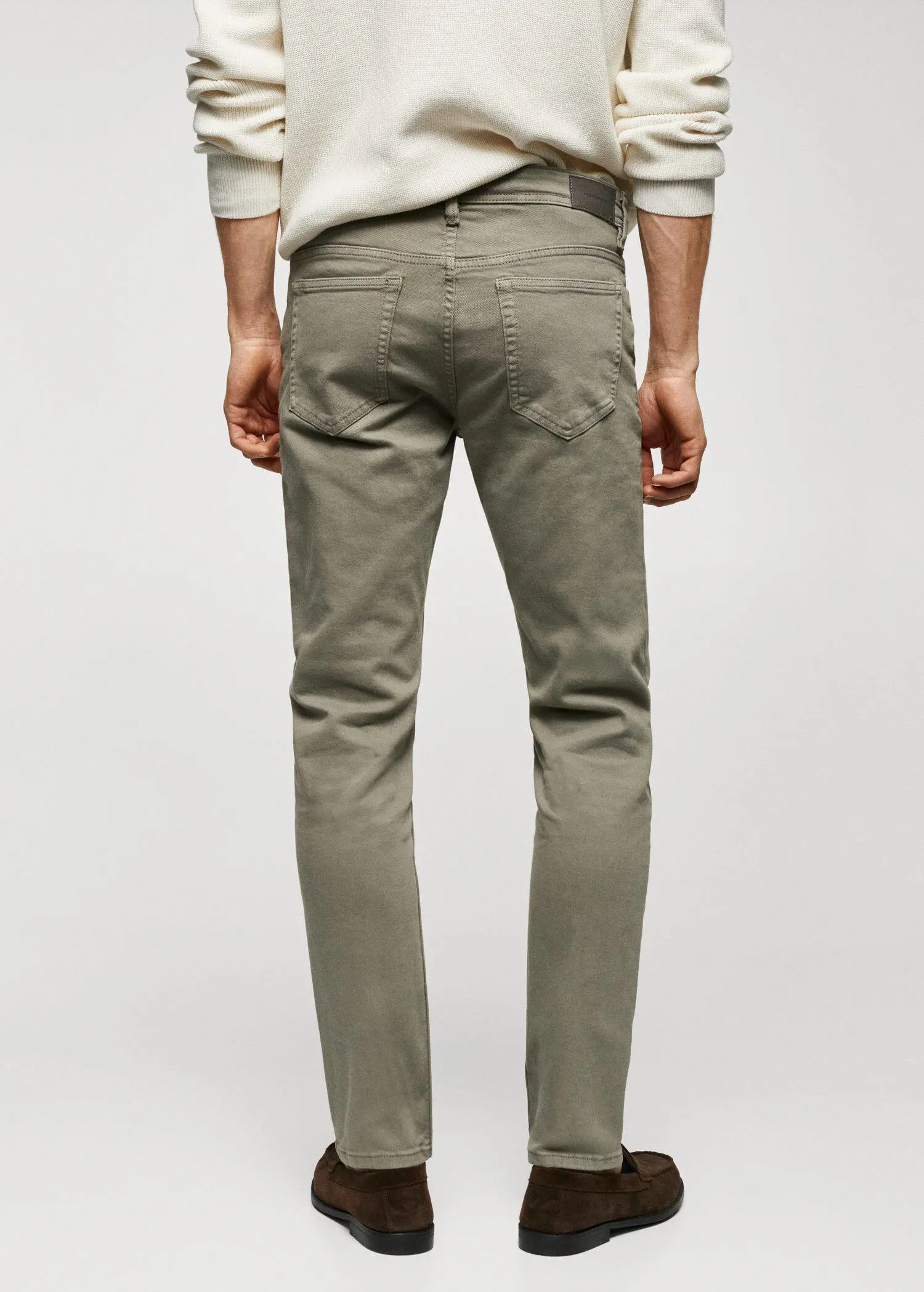Mango Jan slim-fit jeans. a person wearing a pair of khaki colored pants. 