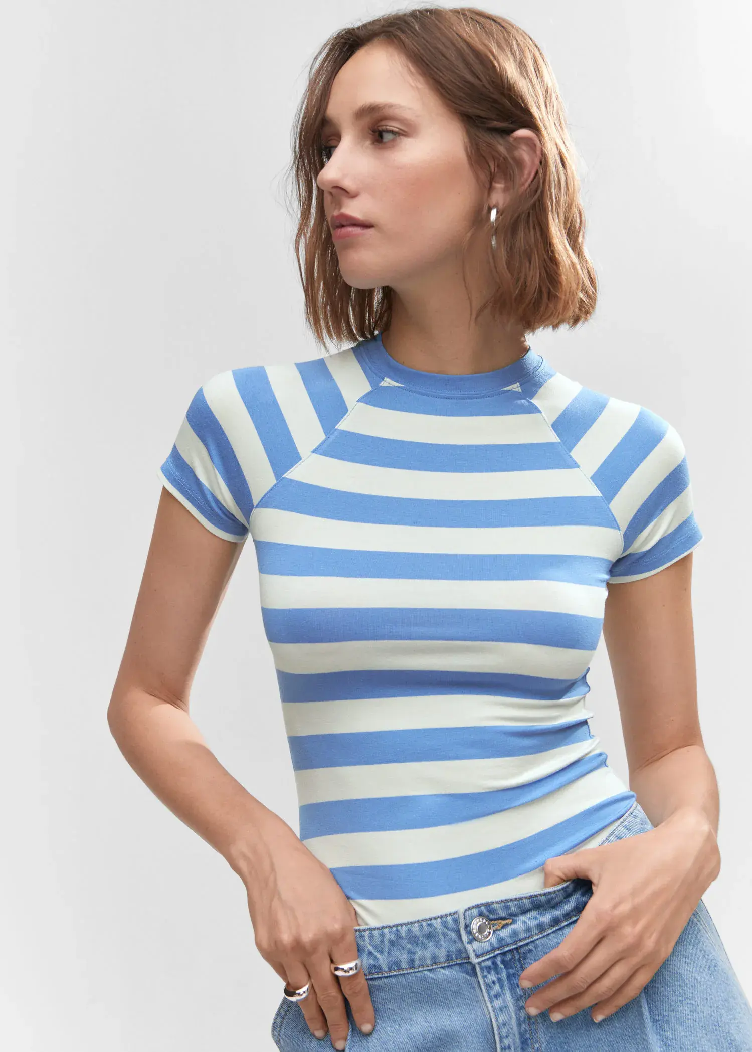 Mango Striped print T-shirt. a woman wearing a blue and white striped shirt. 