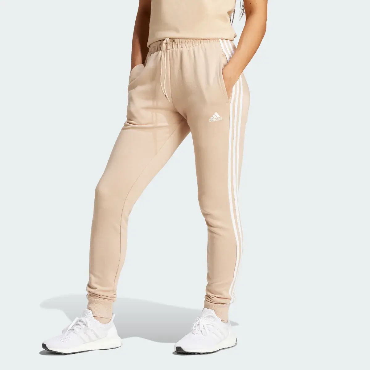 Adidas Essentials 3-Stripes French Terry Cuffed Pants. 1