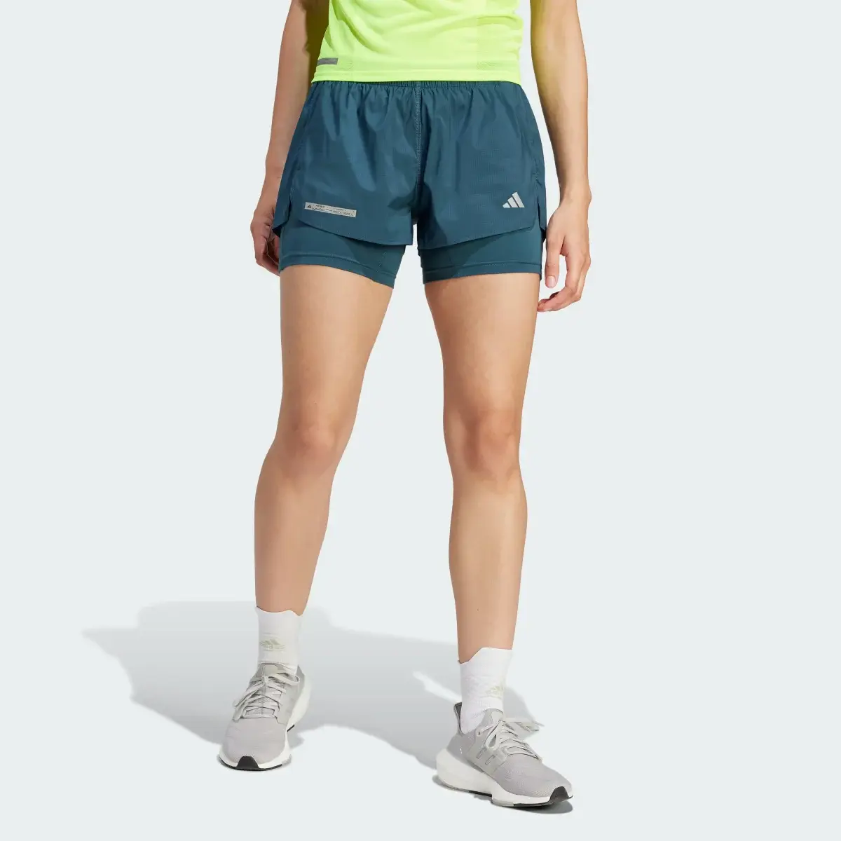 Adidas Shorts Ultimate Dos-en-Uno. 1