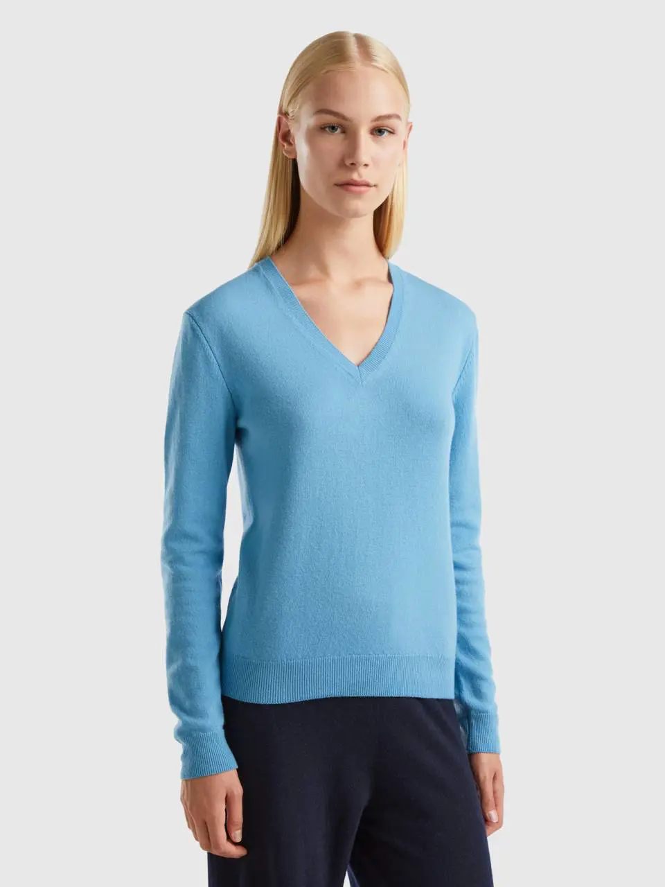 Benetton light blue v-neck sweater in pure merino wool. 1