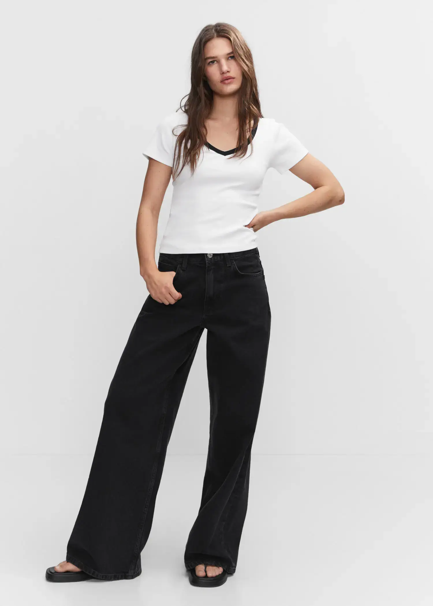 Mango Contrast collar shirt. a woman standing with her hands in her pockets. 